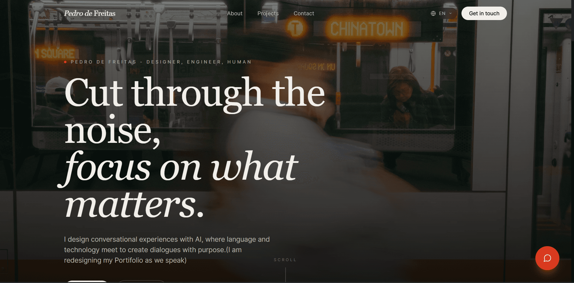 Previous portfolio hero with a dark photo background and a floating chat button in the bottom-right corner